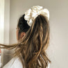 Oversized Chantilly satin scrunchie worn in hair