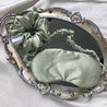 Sage green satin scrunchie and satin sleep mask by LUNARIA DREAMS
